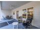 Relaxing covered porch with a ceiling fan, table, and comfortable swivel chair at 5761 Dixie Hwy, Rutledge, GA 30663