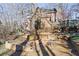 A beautiful backyard, featuring a firepit, with a view of the home's back exterior at 7740 Sagebrush Dr, Atlanta, GA 30350