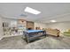 Finished basement with a fireplace, large seating area, and built in shelving at 7740 Sagebrush Dr, Atlanta, GA 30350