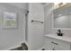 Modern bathroom with a walk-in shower and sleek black fixtures at 7740 Sagebrush Dr, Atlanta, GA 30350