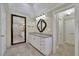 Light-filled bathroom features a large mirror, double sinks, and stylish tile flooring at 7740 Sagebrush Dr, Atlanta, GA 30350