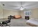 Spacious bedroom with ceiling fan, carpeted floors, and large windows with shutters at 7740 Sagebrush Dr, Atlanta, GA 30350