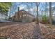 View of the back of the home highlighting the deck and walkout basement at 7740 Sagebrush Dr, Atlanta, GA 30350