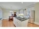 Open kitchen featuring stainless appliances, granite countertops, and adjoining eat-in area at 7740 Sagebrush Dr, Atlanta, GA 30350