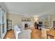 Sunlit living room with hardwood floors, fireplace, and large windows at 7740 Sagebrush Dr, Atlanta, GA 30350