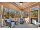 Cozy screened porch features two comfortable armchairs with plush cushions, great for relaxing with a view at 7740 Sagebrush Dr, Atlanta, GA 30350