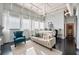 Spacious bedroom with exposed pipes, beams, large windows and comfortable seating area at 120 Ralph Mcgill Ne Blvd # 312, Atlanta, GA 30308