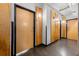Hallway with wooden doors, concrete floors and exposed industrial ceiling at 120 Ralph Mcgill Ne Blvd # 312, Atlanta, GA 30308