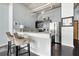 Bright kitchen boasts stainless steel appliances, granite counters, and breakfast bar at 120 Ralph Mcgill Ne Blvd # 312, Atlanta, GA 30308