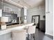 Open-concept kitchen featuring breakfast bar, stainless appliances, and contemporary design at 120 Ralph Mcgill Ne Blvd # 312, Atlanta, GA 30308