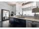 Kitchen with granite countertops, black cabinets and stainless steel dishwasher at 120 Ralph Mcgill Ne Blvd # 312, Atlanta, GA 30308