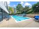 Sparkling outdoor pool with comfortable lounge chairs and lush landscaping at 120 Ralph Mcgill Ne Blvd # 312, Atlanta, GA 30308