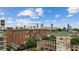 Picturesque aerial view of a brick building, water tower, and Atlanta skyline in the background at 170 Boulevard Se # E127, Atlanta, GA 30312