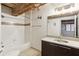 Bright bathroom features a shower-tub combo, a single vanity, granite countertop, and large mirror at 170 Boulevard Se # E127, Atlanta, GA 30312