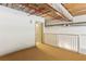 Bedroom featuring carpet, painted beams and pipes, and a railing at 170 Boulevard Se # E127, Atlanta, GA 30312