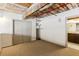 Bedroom featuring carpet, closet, painted beams and pipes, with ensuite bath at 170 Boulevard Se # E127, Atlanta, GA 30312
