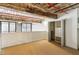 Bedroom featuring carpet, painted beams and pipes, closet, and view to the living area below at 170 Boulevard Se # E127, Atlanta, GA 30312