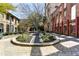 Beautiful courtyard with manicured landscaping, stone pavers, and architectural ruins at 170 Boulevard Se # E127, Atlanta, GA 30312