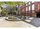 Beautiful courtyard with manicured landscaping, stone pavers, and architectural ruins at 170 Boulevard Se # E127, Atlanta, GA 30312