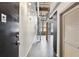 Hallway featuring a spiral staircase and industrial-style design with exposed pipes and brick accents at 170 Boulevard Se # E127, Atlanta, GA 30312