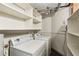 Functional laundry room equipped with washer, dryer, and shelving for ample storage solutions at 170 Boulevard Se # E127, Atlanta, GA 30312