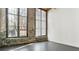 Bright living room featuring large windows with exposed brick walls at 170 Boulevard Se # E127, Atlanta, GA 30312