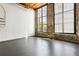 Bright living room featuring large windows and exposed brick walls with painted accents at 170 Boulevard Se # E127, Atlanta, GA 30312