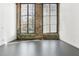 Spacious living area featuring exposed brick, large windows, and sleek flooring, ideal for modern living at 170 Boulevard Se # E127, Atlanta, GA 30312