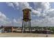 Historic water tower overlooking rooftops and treeline, set against a beautiful blue sky at 170 Boulevard Se # 127E, Atlanta, GA 30312