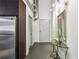 Hallway with modern stainless steel appliances, doors, mirror and table at 170 Boulevard Se # E127, Atlanta, GA 30312