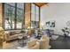 Spacious living room with exposed brick, large windows, and stylish furniture with contemporary decor at 170 Boulevard Se # E127, Atlanta, GA 30312