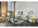 Bright living room with tall windows, exposed brick accent wall, and comfortable seating with elegant décor at 170 Boulevard Se # E127, Atlanta, GA 30312