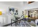 Open floor plan with a modern desk, kitchen with stainless appliances, and seating area with lots of natural light at 170 Boulevard Se # E127, Atlanta, GA 30312