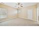 Bedroom featuring a ceiling fan and neutral colored walls and carpet at 189 Privet Cir, Suwanee, GA 30024