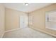 Bedroom with neutral walls and carpet, and a double-door closet at 189 Privet Cir, Suwanee, GA 30024