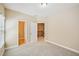 Bedroom with plush carpet and a view of the stairway at 189 Privet Cir, Suwanee, GA 30024
