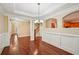 Formal dining room featuring a chandelier and wood floors at 189 Privet Cir, Suwanee, GA 30024