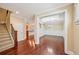 Elegant dining room with hardwood floors, decorative wainscoting, and a coffered ceiling at 189 Privet Cir, Suwanee, GA 30024