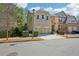 Attractive brick and siding home featuring an attached two-car garage and front yard greenery at 189 Privet Cir, Suwanee, GA 30024