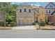 Charming brick front exterior with a two-car garage and well-maintained landscaping at 189 Privet Cir, Suwanee, GA 30024