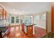 Open kitchen with stainless appliances, an island, and sliding doors leading to the outdoors at 189 Privet Cir, Suwanee, GA 30024