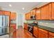 Gourmet kitchen with stainless appliances, granite counters, and custom cabinetry at 189 Privet Cir, Suwanee, GA 30024