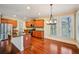 Bright kitchen with stainless steel appliances, a large island, and a dining area at 189 Privet Cir, Suwanee, GA 30024