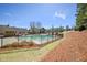 The neighborhood pool includes lush landscaping with mature trees, offering shade and privacy at 189 Privet Cir, Suwanee, GA 30024