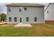 Back exterior of home with siding, a sliding glass door, and a grassy yard at 2955 Jefferson St, Austell, GA 30106