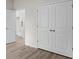 Bedroom view with double door closet and entry to modern kitchen at 2955 Jefferson St, Austell, GA 30106
