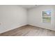 Bright bedroom with a large window and modern laminate flooring at 2955 Jefferson St, Austell, GA 30106