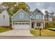 Charming two-story home with a two-car garage, a well-maintained lawn, and appealing curb appeal at 2955 Jefferson St, Austell, GA 30106