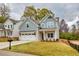 Beautiful two-story house with a manicured front lawn, two-car garage, and classic mailbox at 2955 Jefferson St, Austell, GA 30106