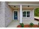 Inviting front porch with stylish blue door, brick facade, and well-lit entrance at 2955 Jefferson St, Austell, GA 30106